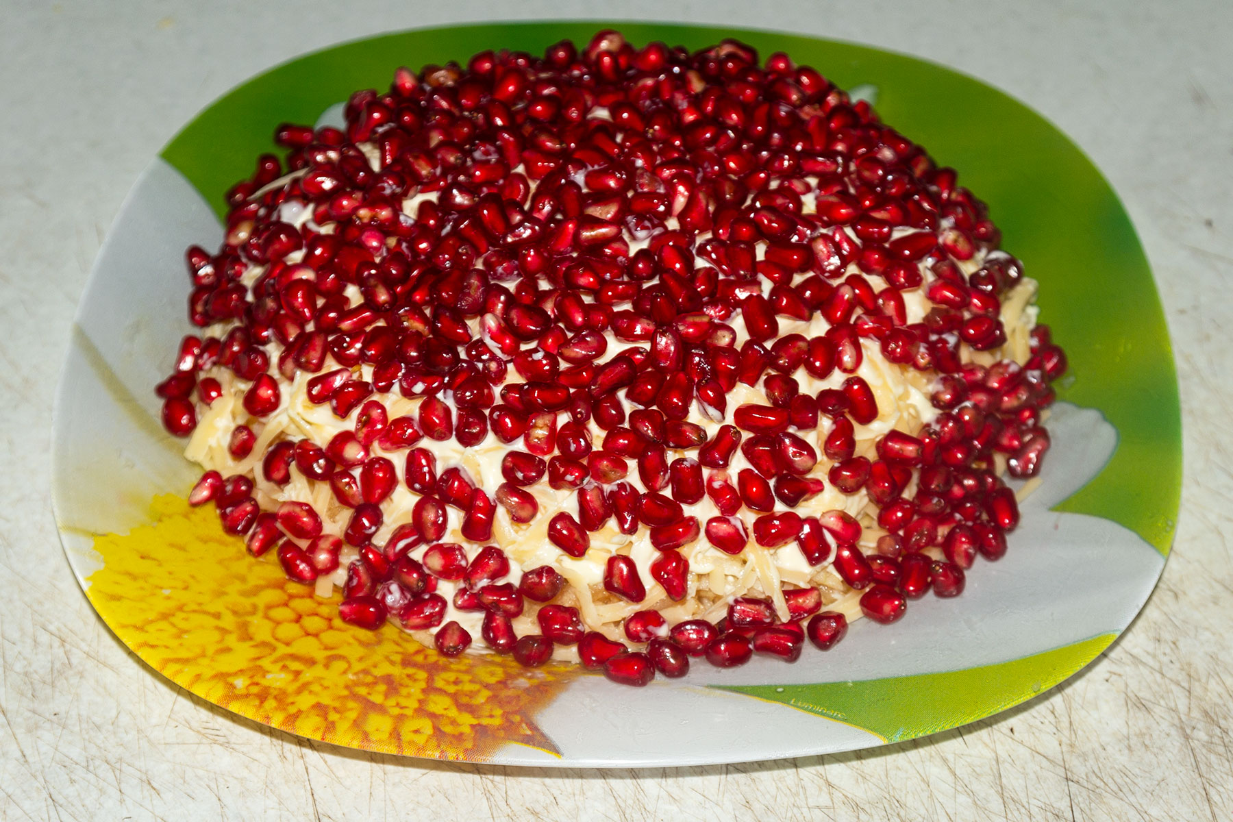 Салат "Гранатовый браслет" с рыбой