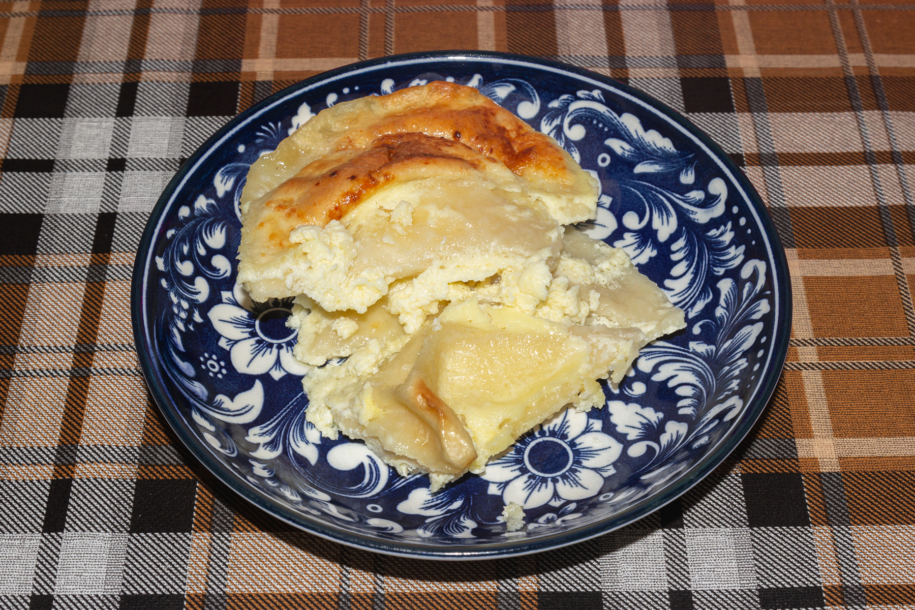 Вареники с творогом, запеченные в сметане